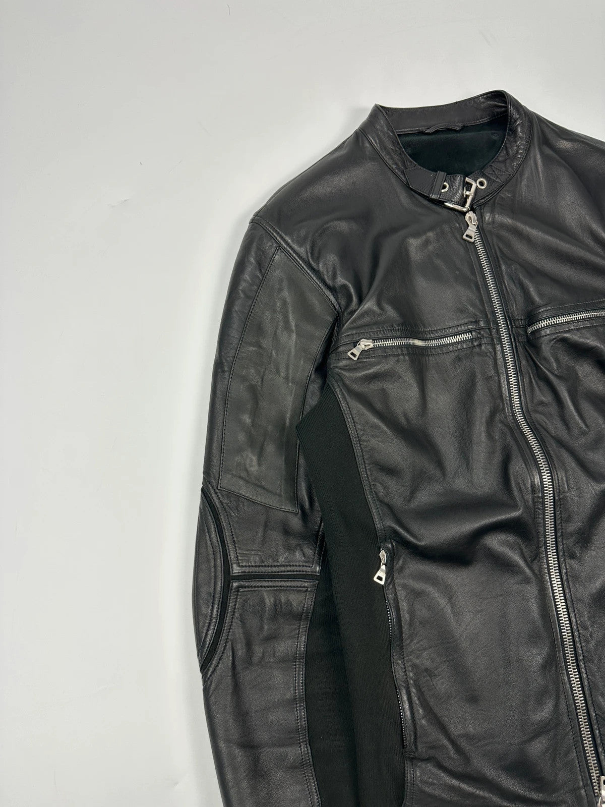 Prada black leather and cotton motor panel jacket with biker-style reinforced details.