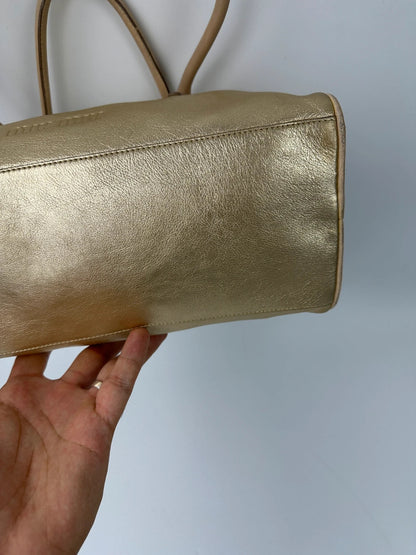 Miu Miu gold leather handbag with shiny finish and vintage 90’s design.