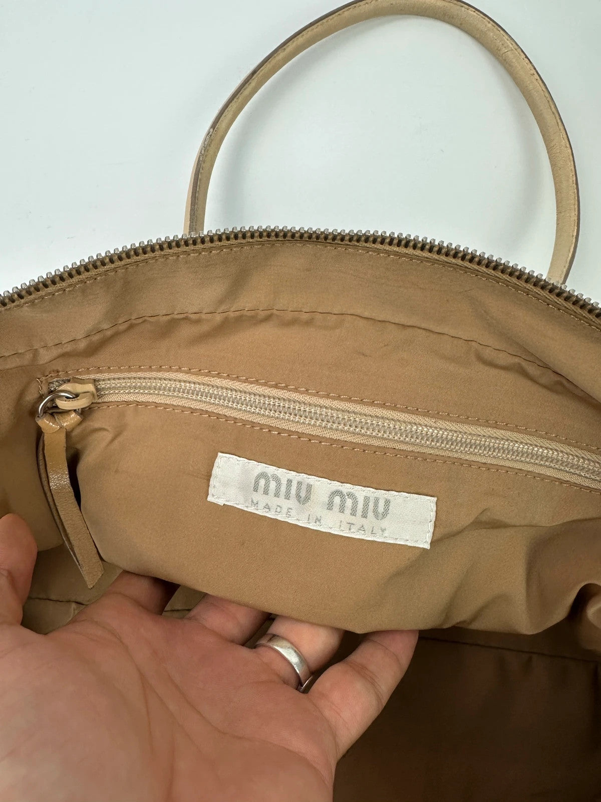 Miu Miu gold leather handbag with shiny finish and vintage 90’s design.