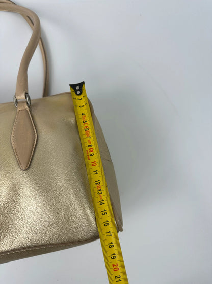 Miu Miu gold leather handbag with shiny finish and vintage 90’s design.
