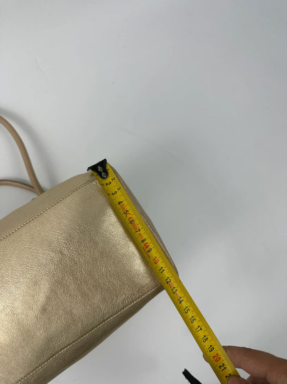 Miu Miu gold leather handbag with shiny finish and vintage 90’s design.