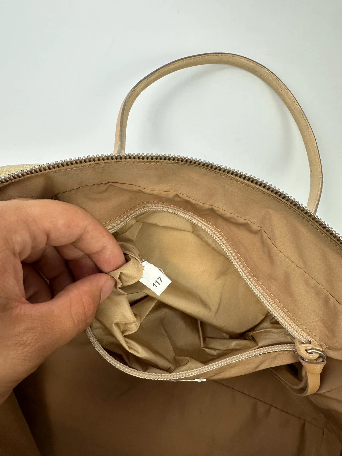 Miu Miu gold leather handbag with shiny finish and vintage 90’s design.
