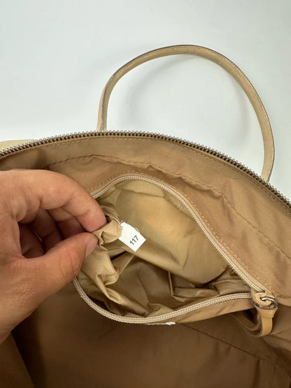 Miu Miu gold leather handbag with shiny finish and vintage 90’s design.