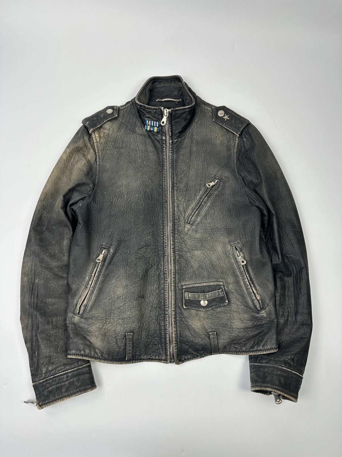 Dolce & Gabbana grey bomber jacket with unique eroded leather finish and faded details.