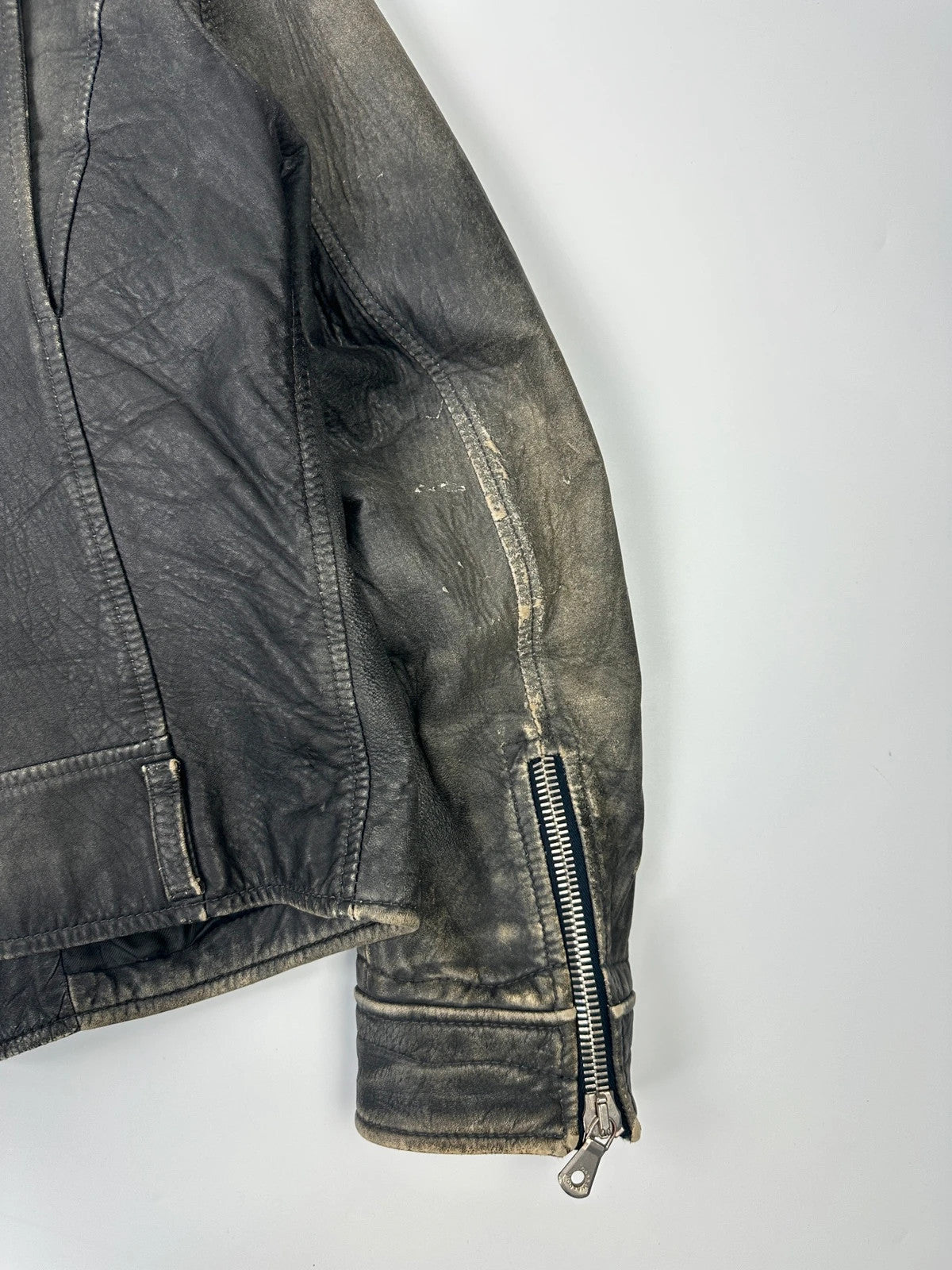 Dolce & Gabbana grey bomber jacket with unique eroded leather finish and faded details.