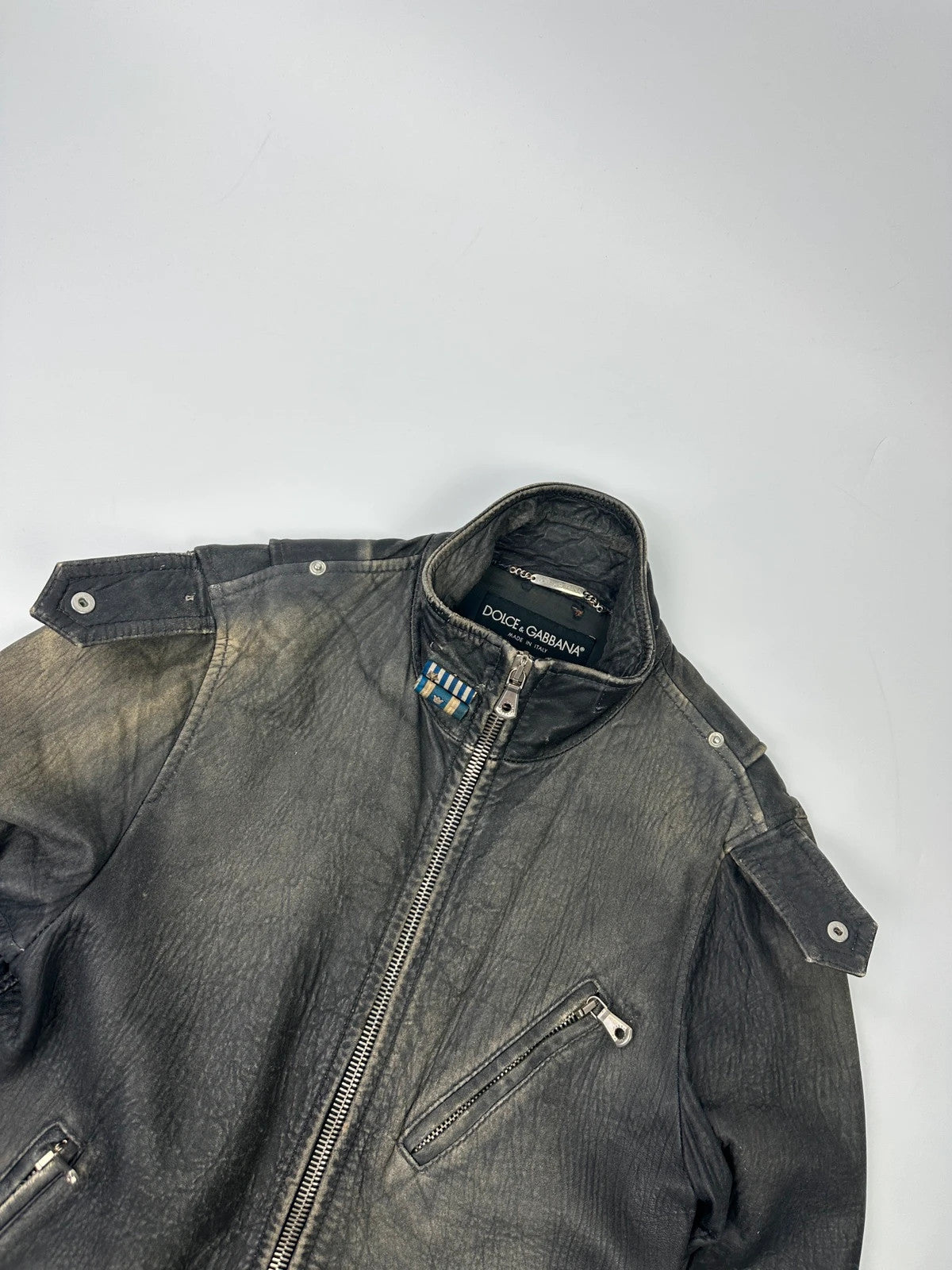 Dolce & Gabbana grey bomber jacket with unique eroded leather finish and faded details.