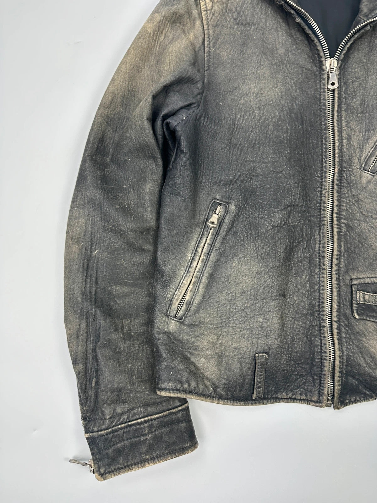 Dolce & Gabbana grey bomber jacket with unique eroded leather finish and faded details.