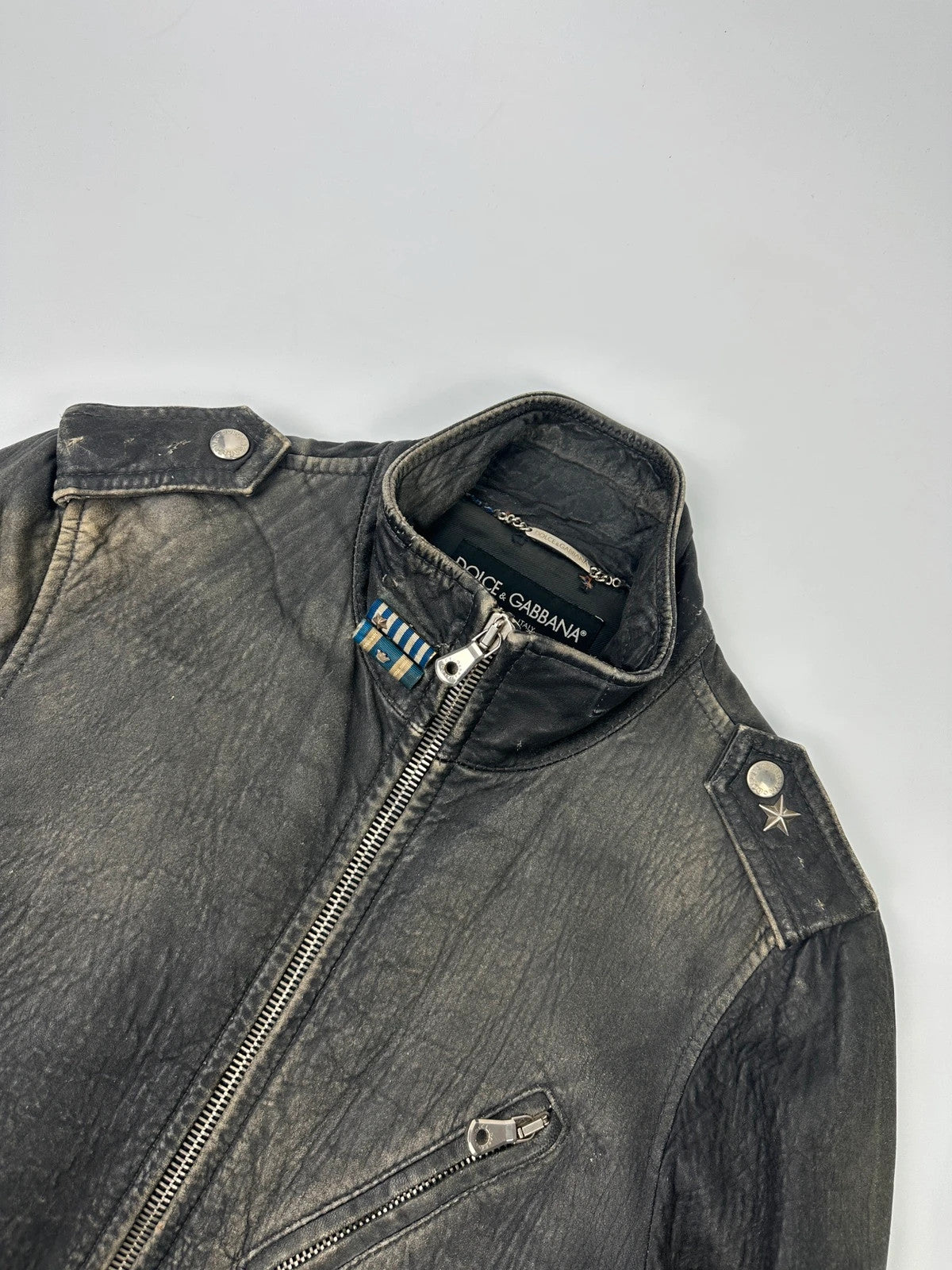 Dolce & Gabbana grey bomber jacket with unique eroded leather finish and faded details.