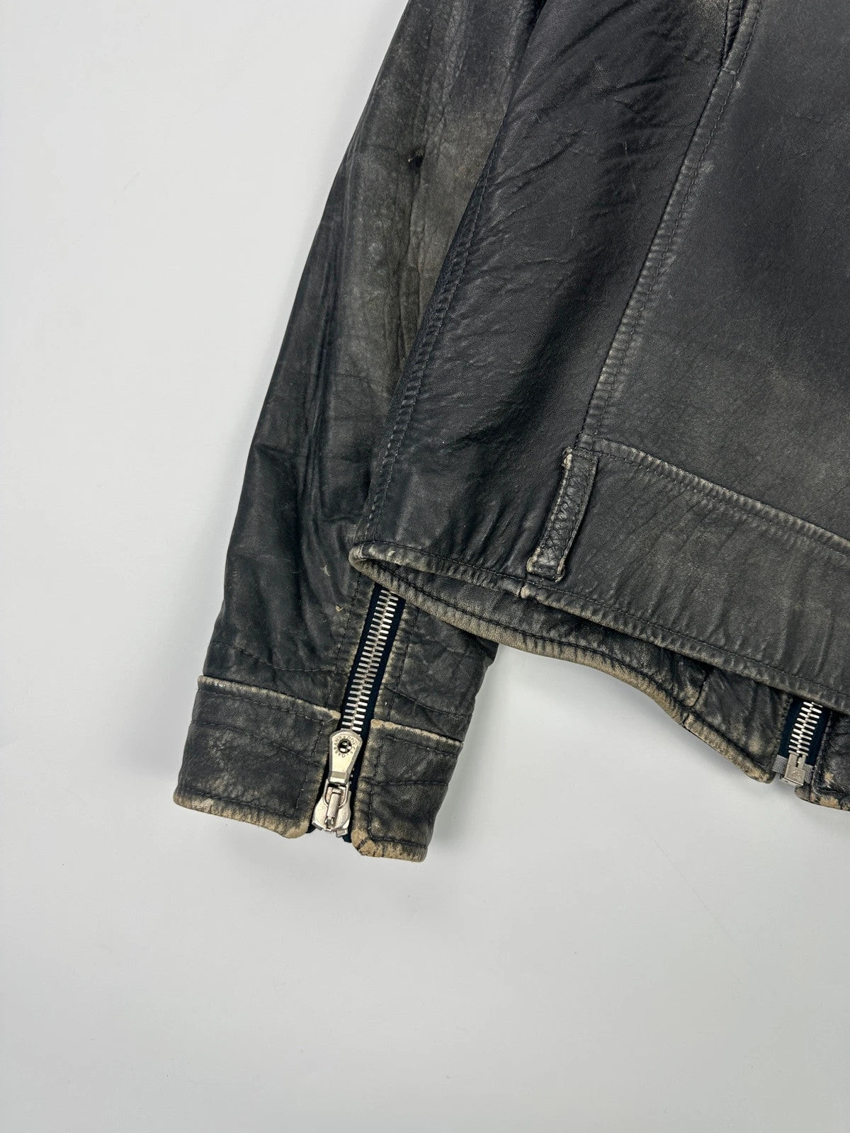 Dolce & Gabbana grey bomber jacket with unique eroded leather finish and faded details.