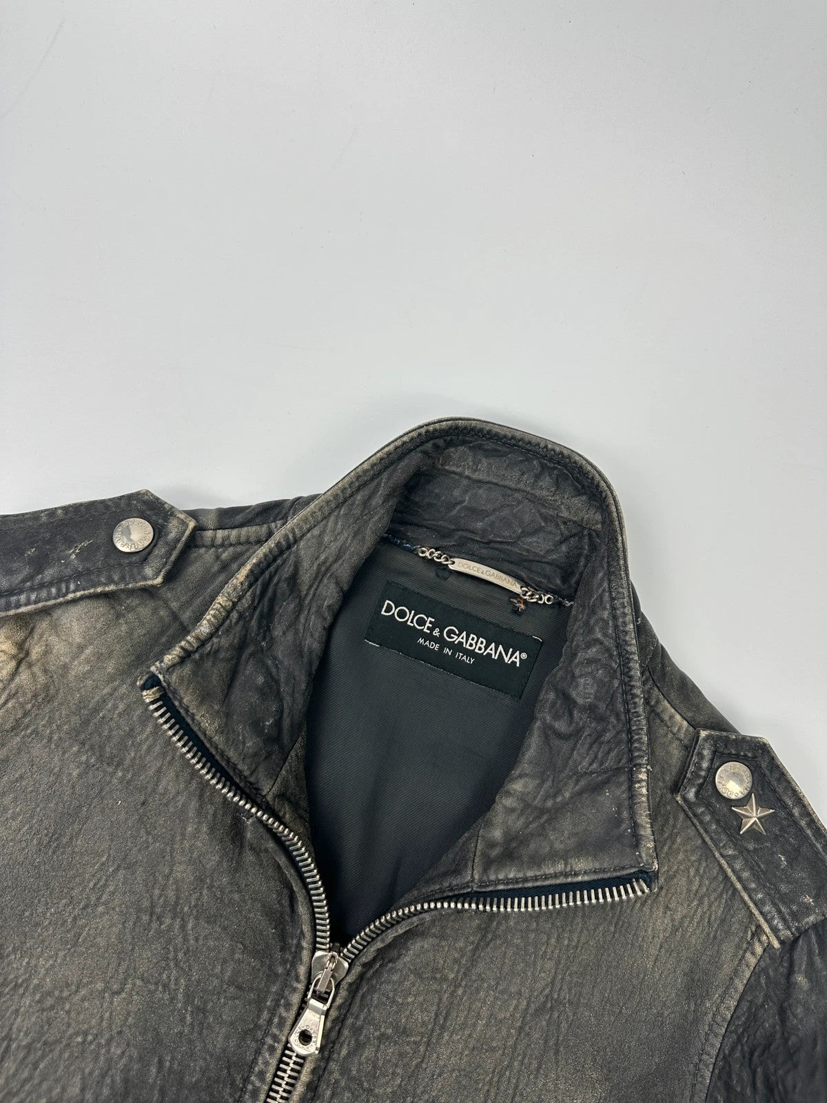 Dolce & Gabbana grey bomber jacket with unique eroded leather finish and faded details.