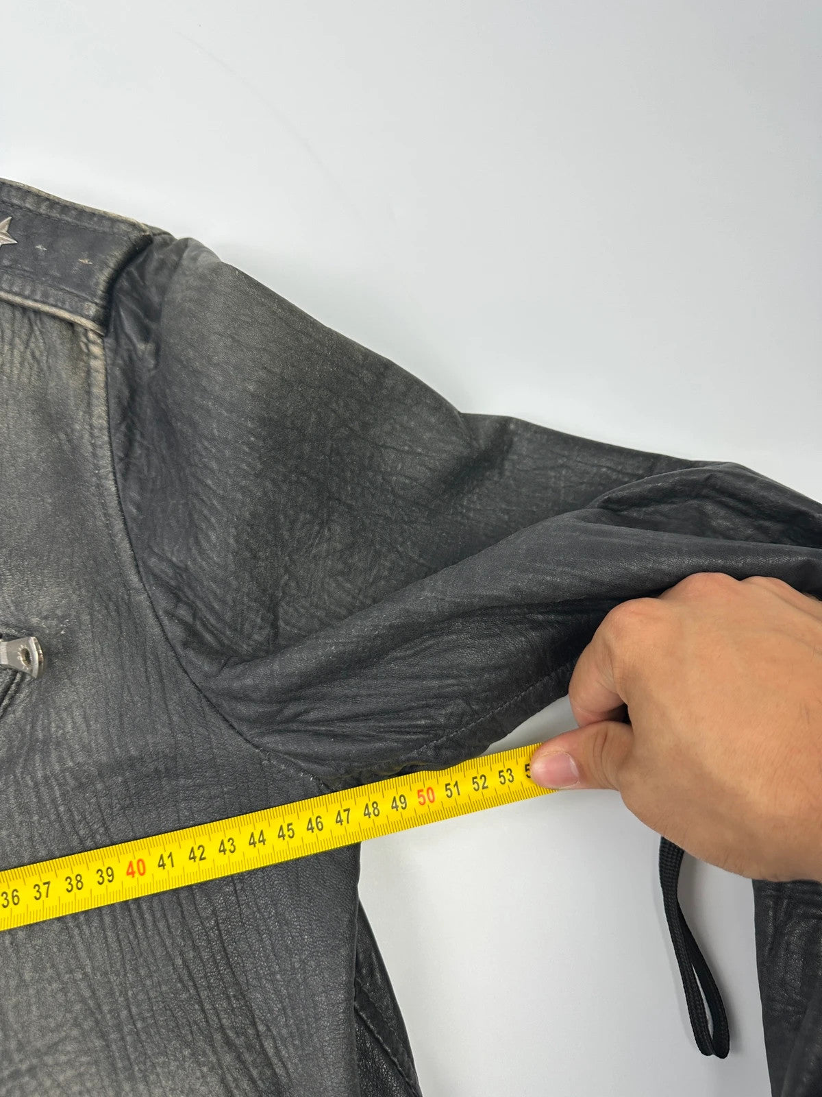 Dolce & Gabbana grey bomber jacket with unique eroded leather finish and faded details.