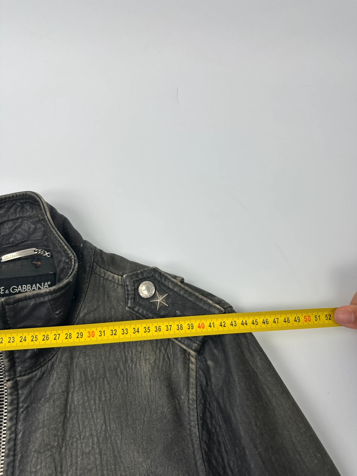 Dolce & Gabbana grey bomber jacket with unique eroded leather finish and faded details.