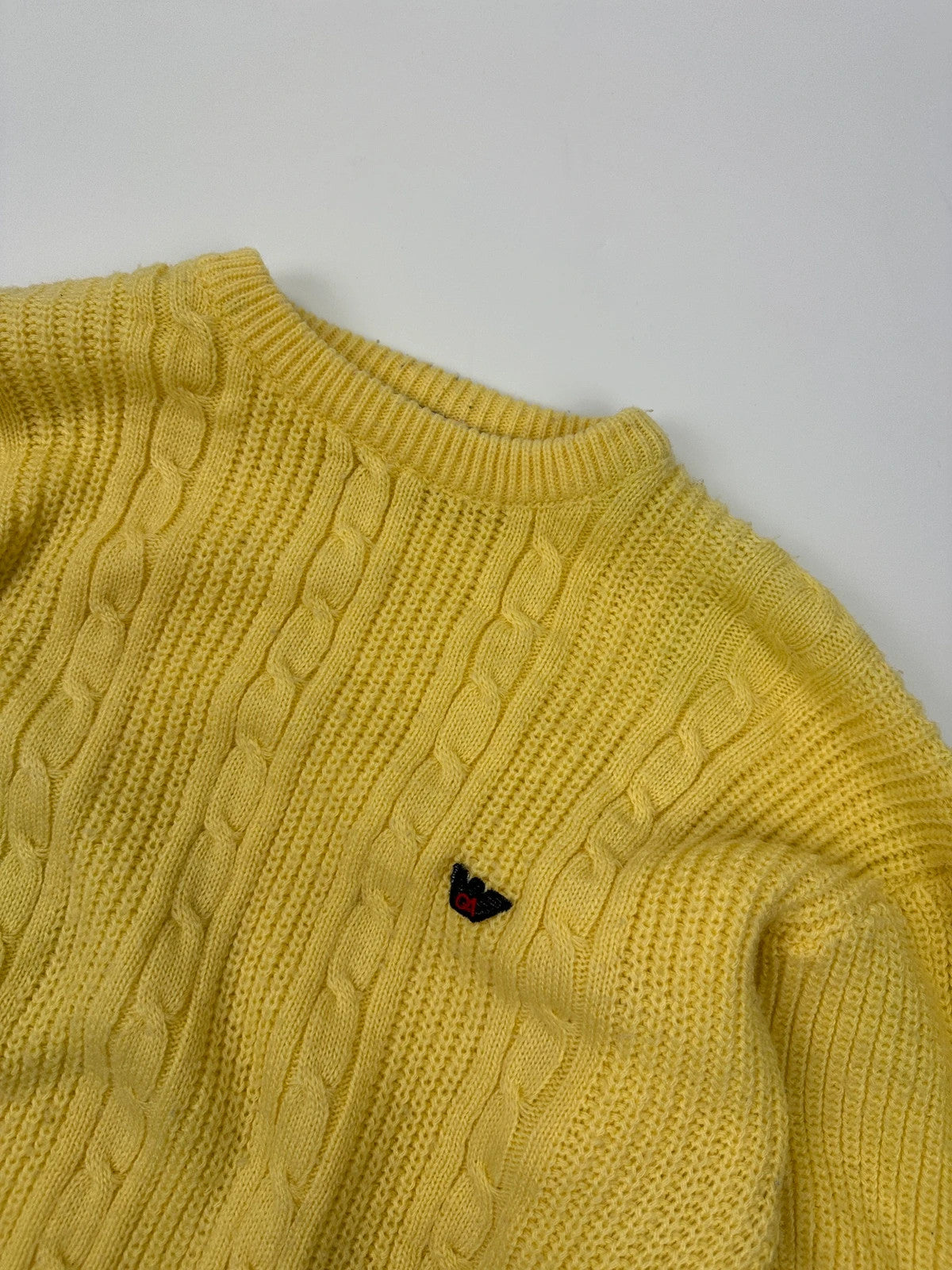 Emporio Armani yellow cable knit sweater with 90's design and classic logo detail.