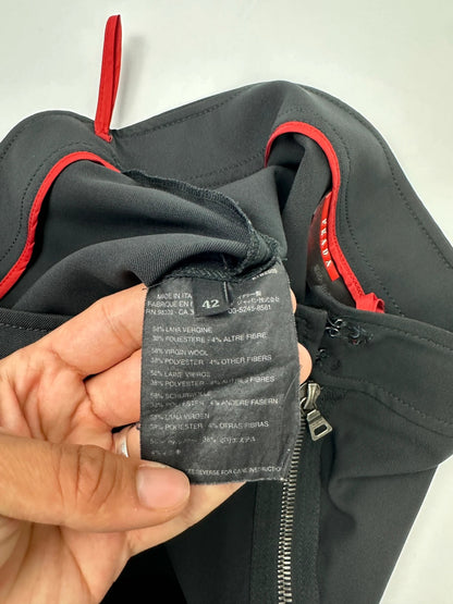 Prada black wool mid-length skirt with minimalist design and linearossa logo.