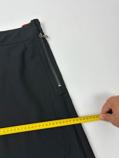 Prada black wool mid-length skirt with minimalist design and linearossa logo.