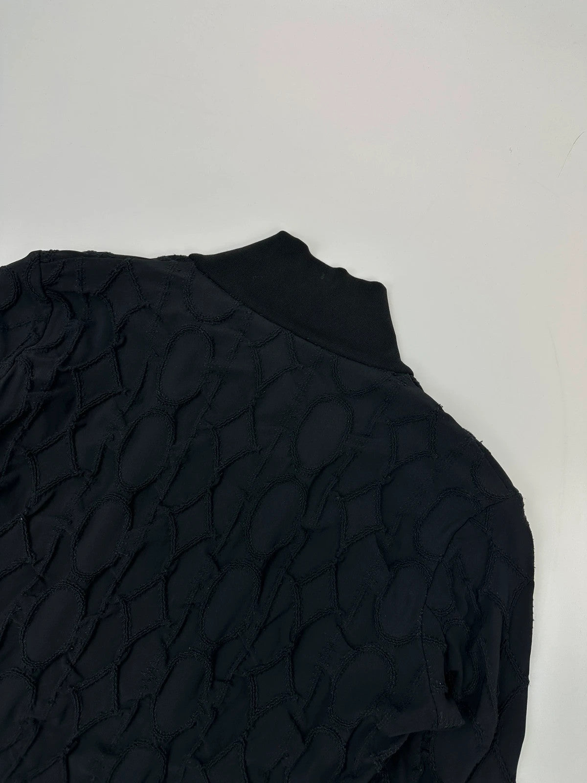 Marithé François Girbaud black fitted jacket with 2000s embroidery and minimalist design.