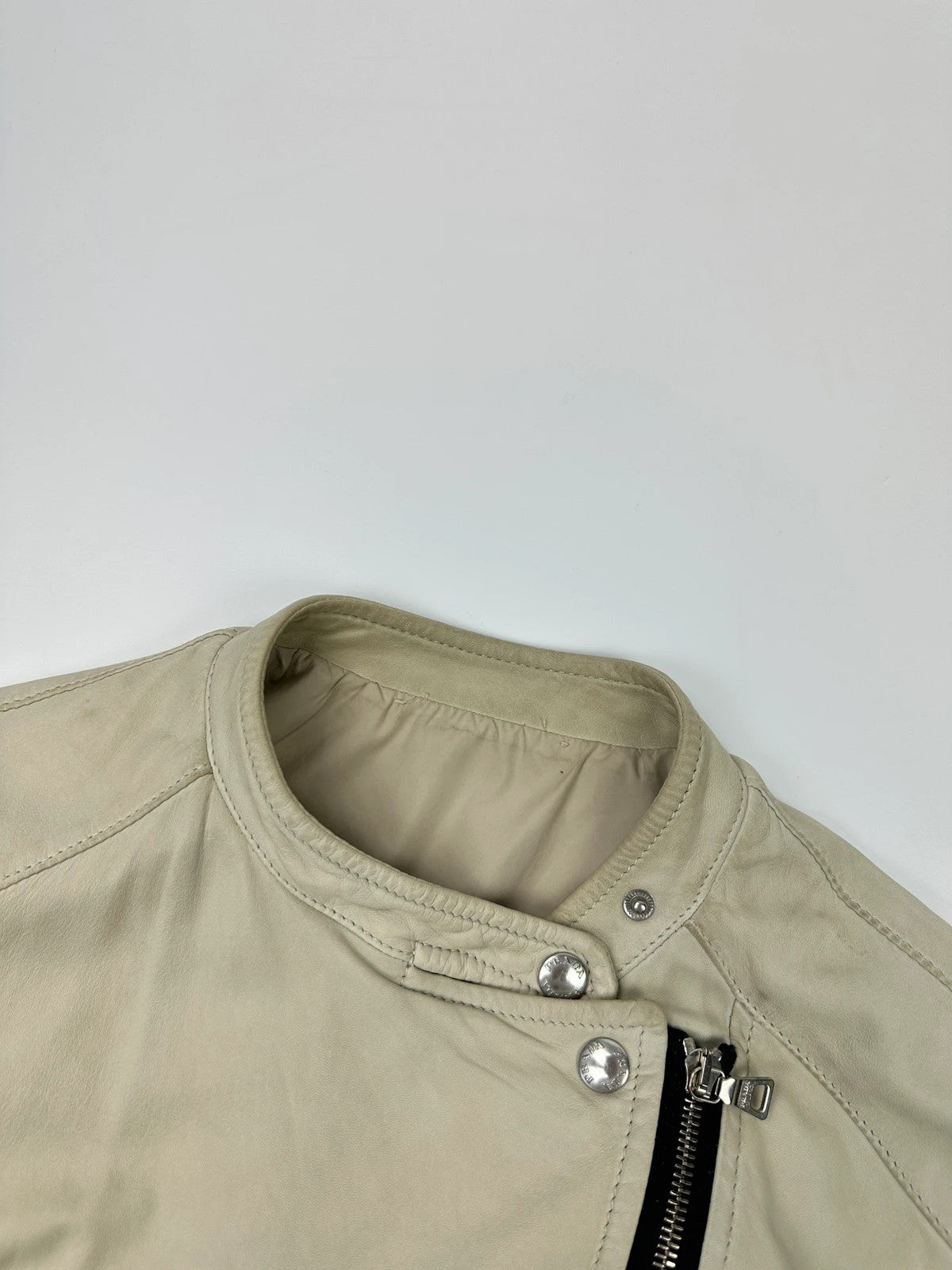 Prada beige leather fitted jacket with multi pockets and logo detailing.