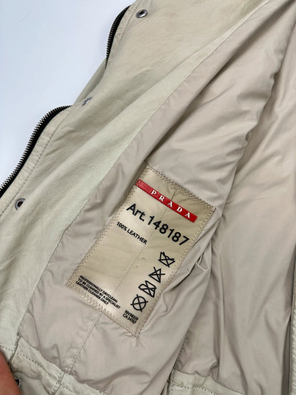 Prada beige leather fitted jacket with multi pockets and logo detailing.