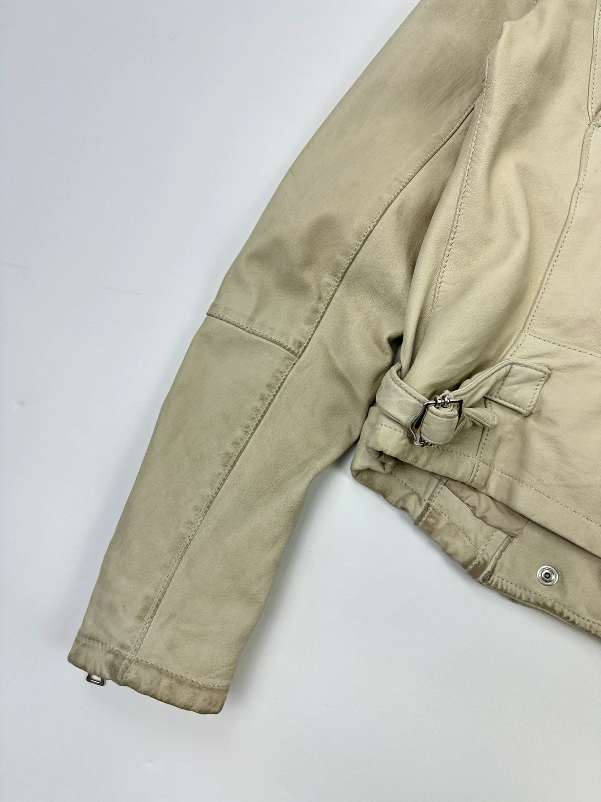 Prada beige leather fitted jacket with multi pockets and logo detailing.