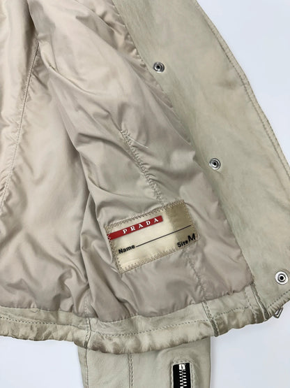 Prada beige leather fitted jacket with multi pockets and logo detailing.