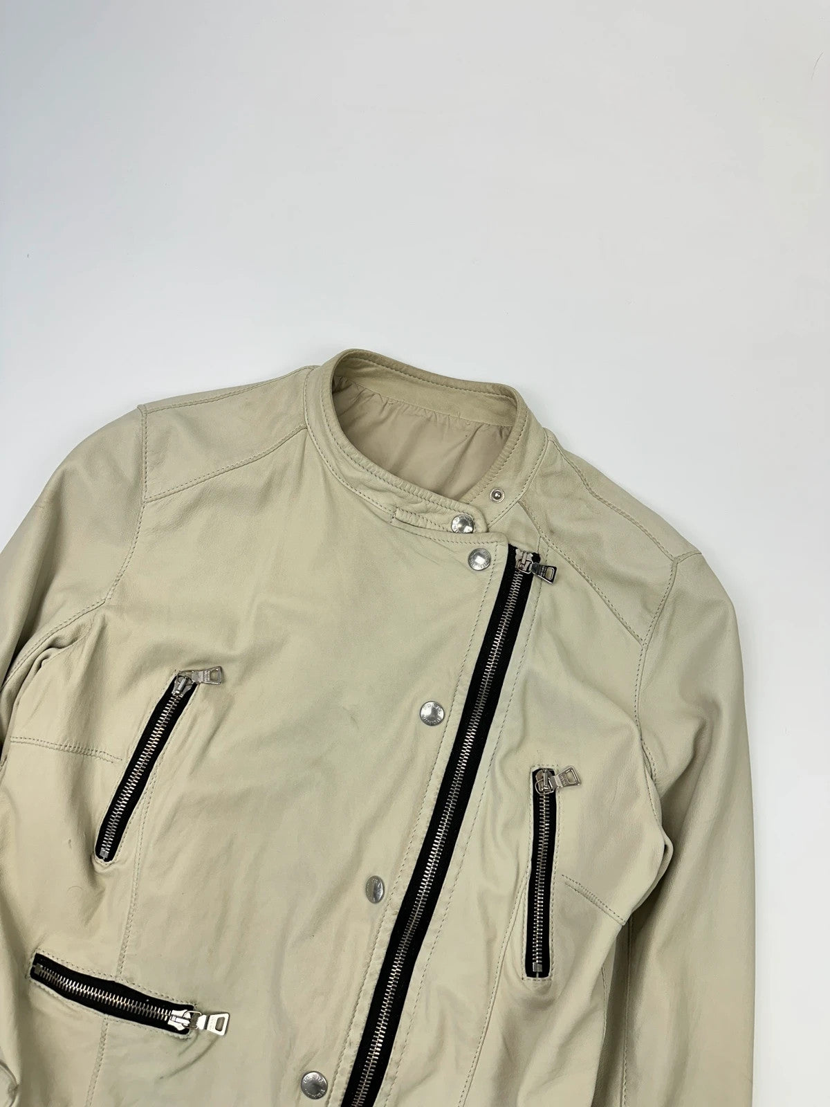 Prada beige leather fitted jacket with multi pockets and logo detailing.