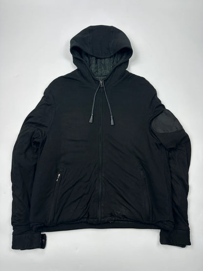 Prada black padded hooded jacket with 90s-inspired patch and braided drawstrings.