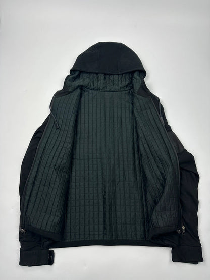 Prada black padded hooded jacket with 90s-inspired patch and braided drawstrings.