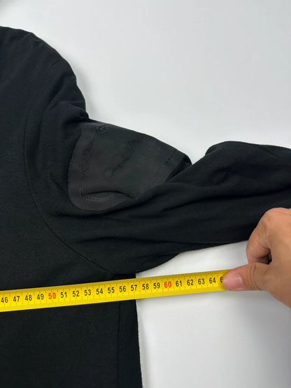 Prada black padded hooded jacket with 90s-inspired patch and braided drawstrings.