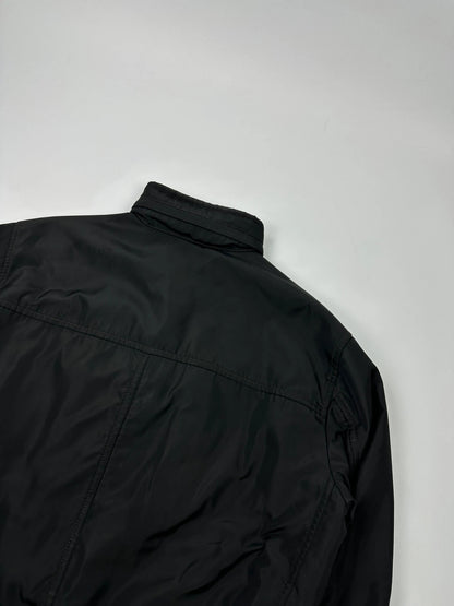 Prada black bomber jacket with hidden hood, minimalist design, luxury runway archive.