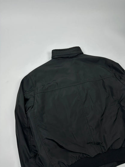 Prada black bomber jacket with hidden hood, minimalist design, luxury runway archive.