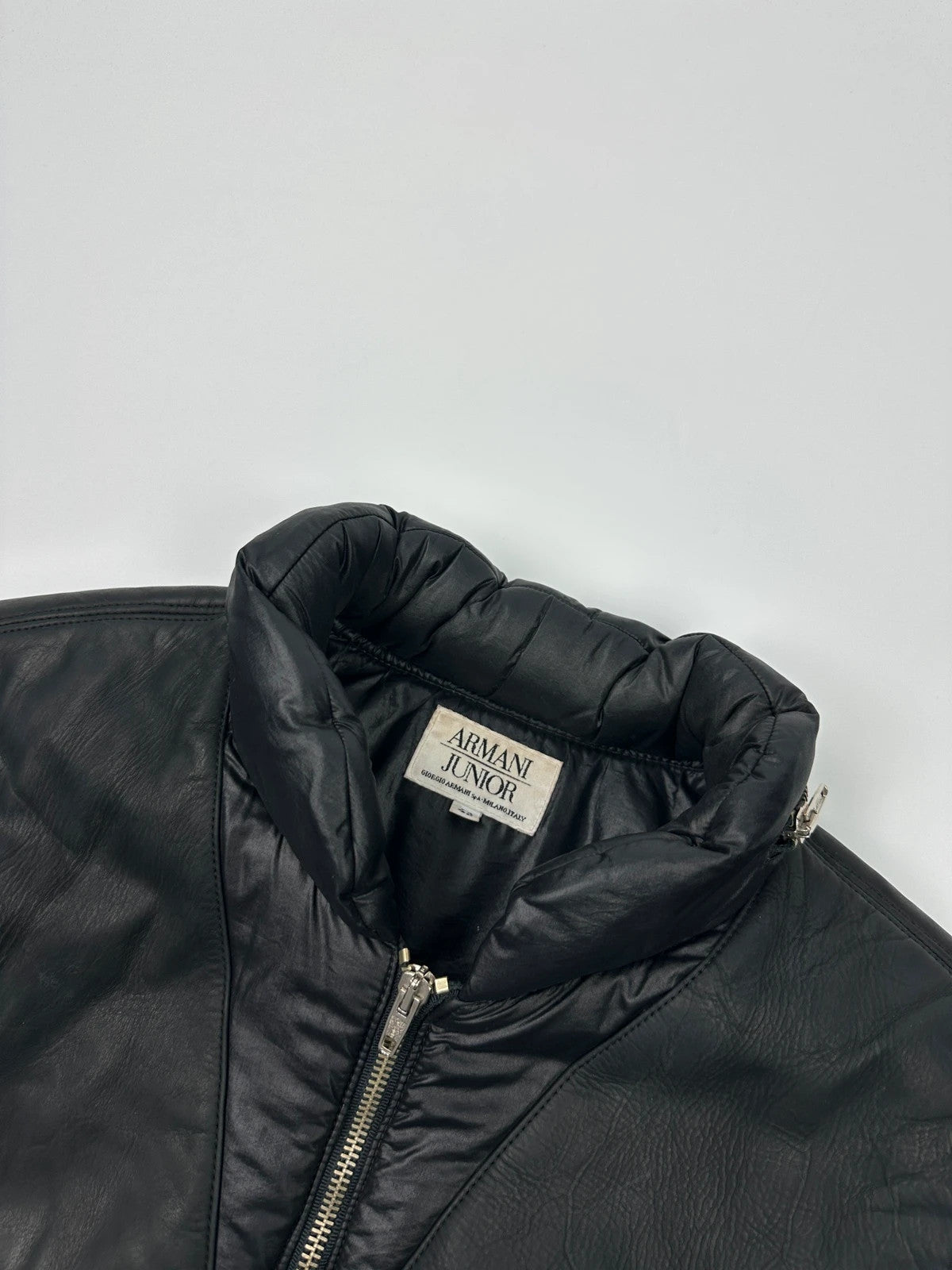 Armani black puffer bomber jacket, leather and nylon, removable sleeves, vintage 90s style.