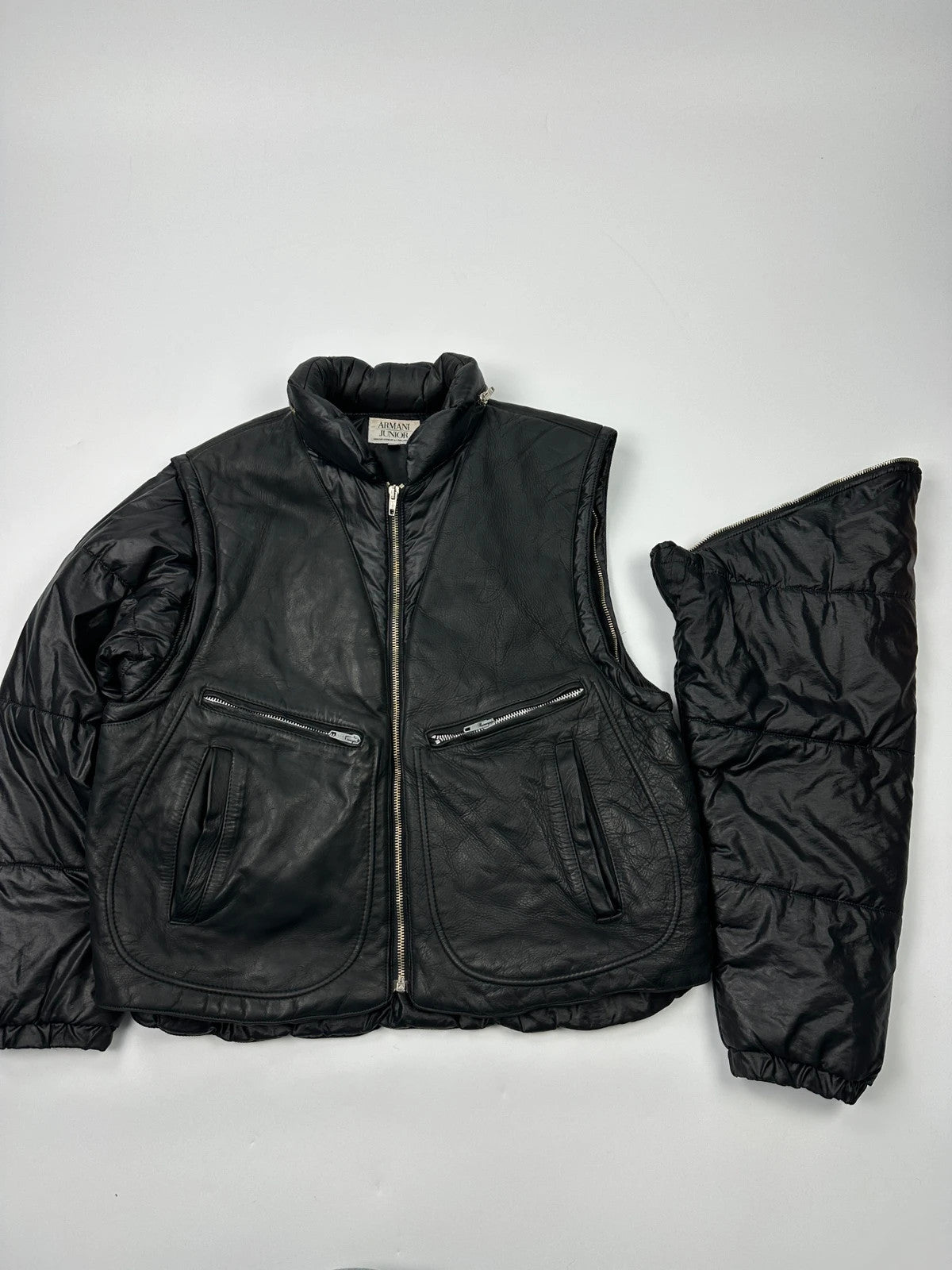 Armani black puffer bomber jacket, leather and nylon, removable sleeves, vintage 90s style.