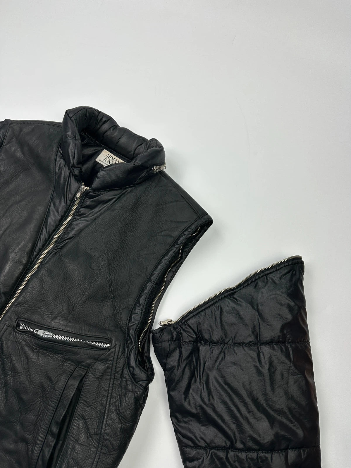 Armani black puffer bomber jacket, leather and nylon, removable sleeves, vintage 90s style.