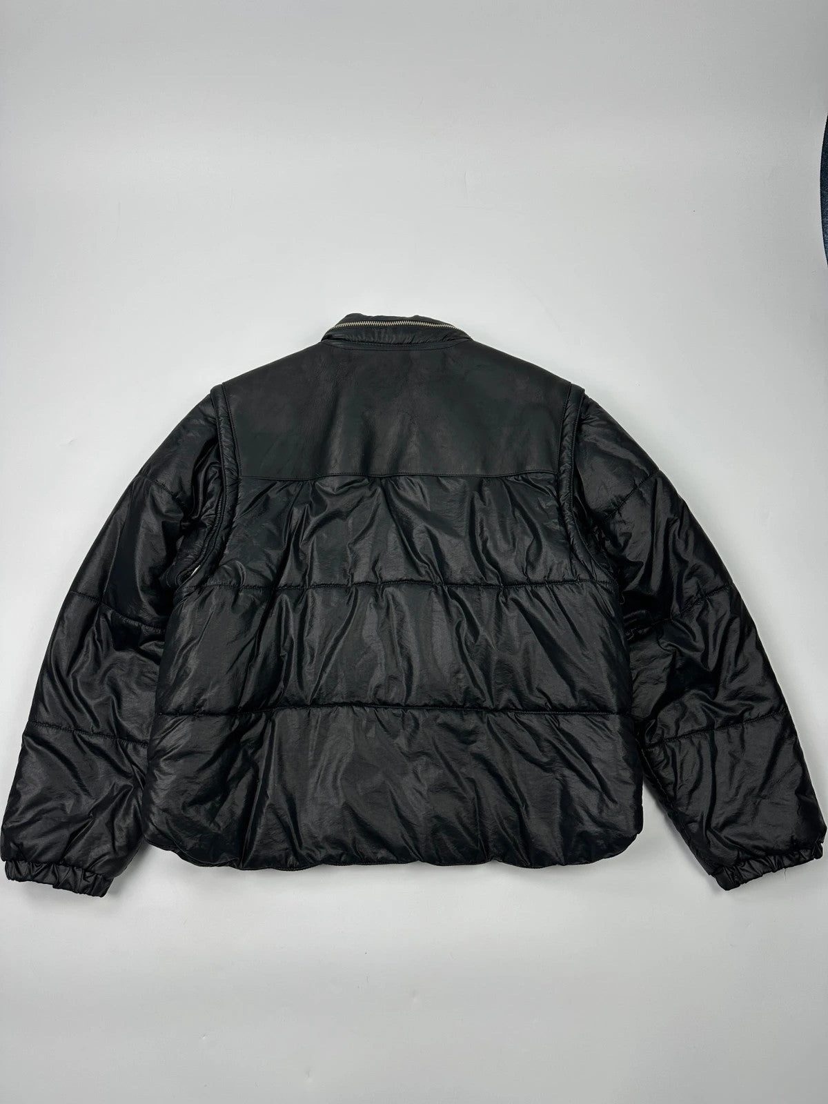 Armani black puffer bomber jacket, leather and nylon, removable sleeves, vintage 90s style.