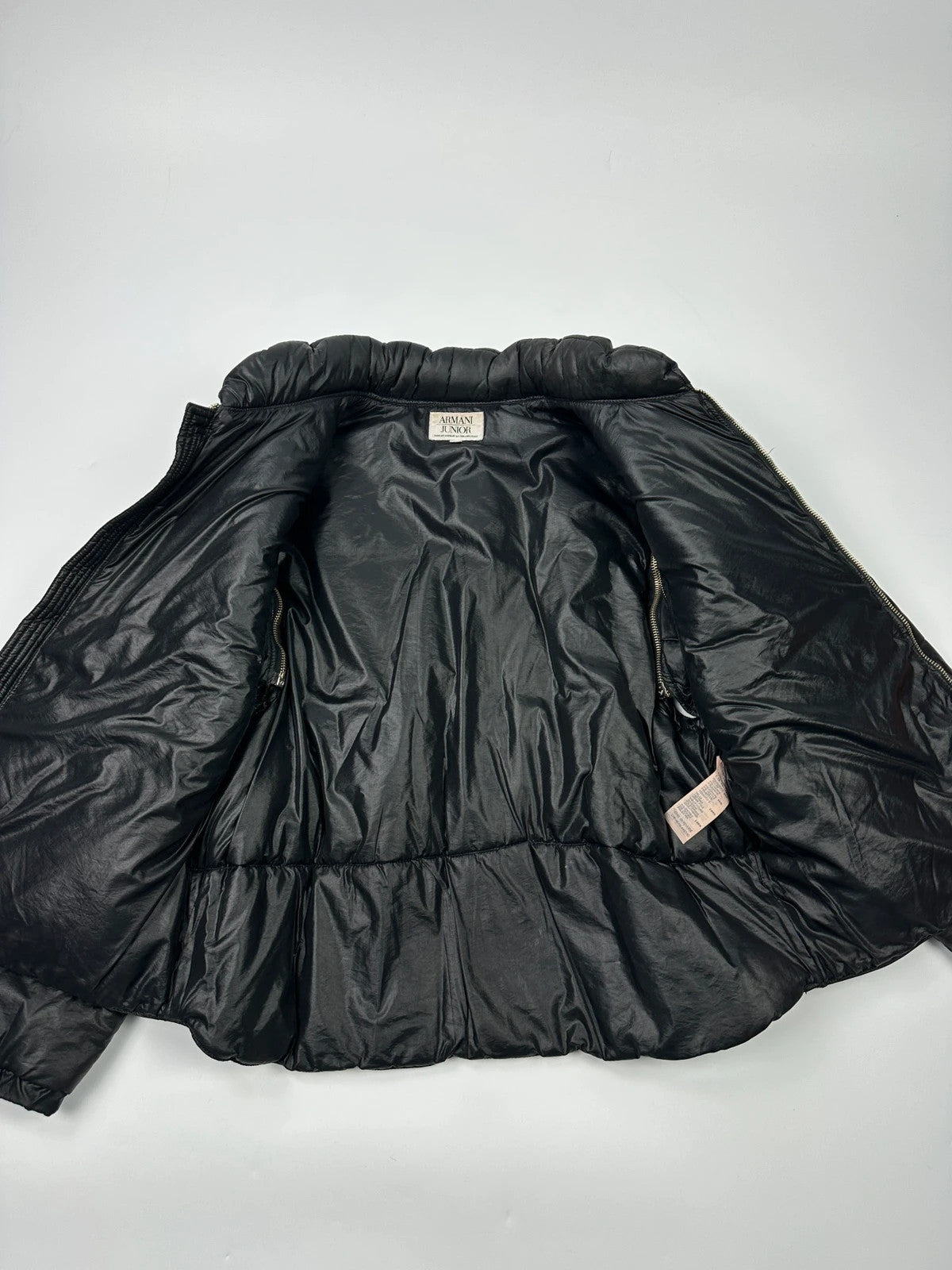 Armani black puffer bomber jacket, leather and nylon, removable sleeves, vintage 90s style.