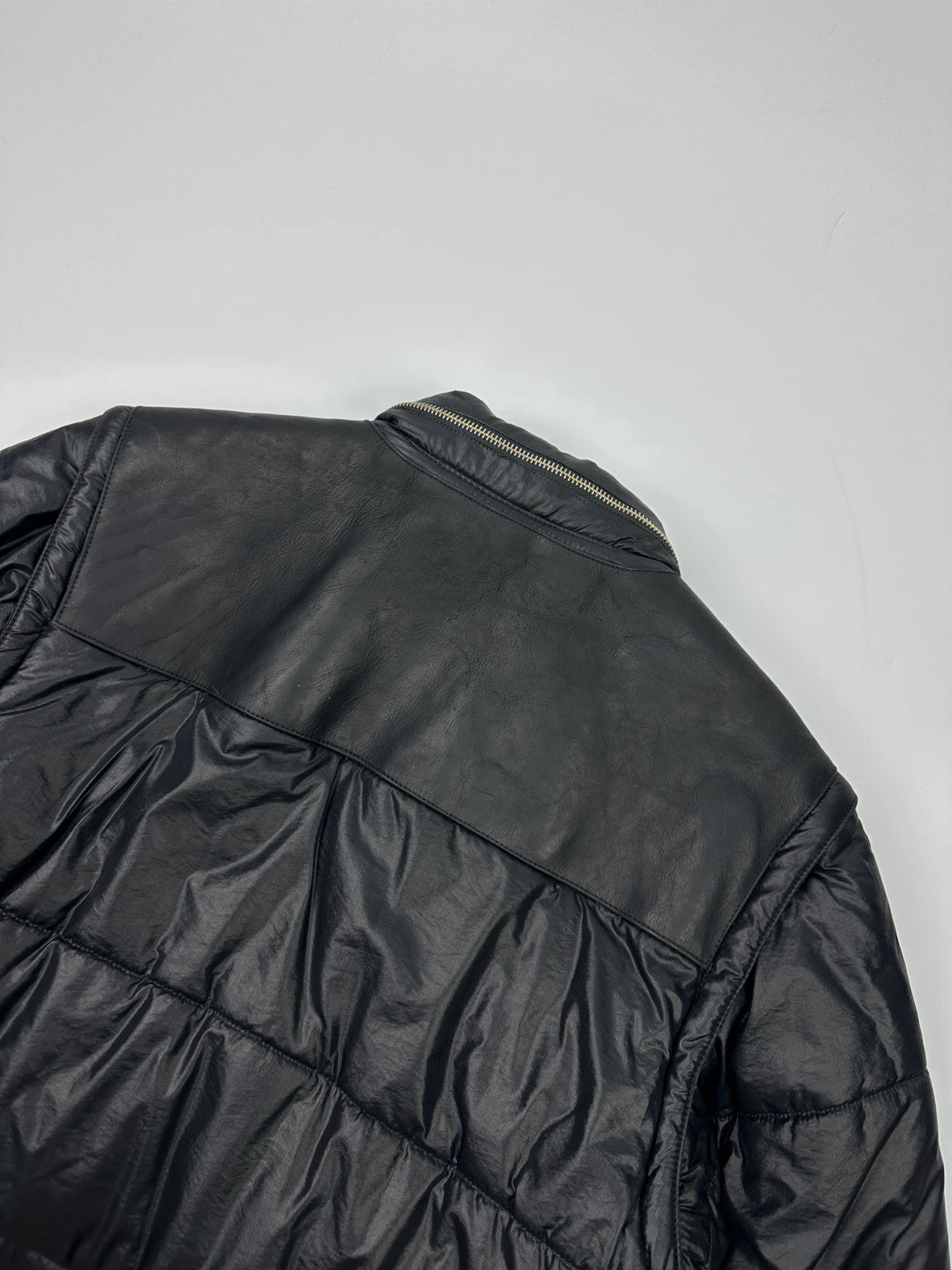 Armani black puffer bomber jacket, leather and nylon, removable sleeves, vintage 90s style.