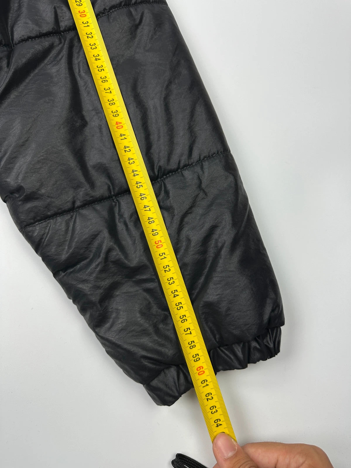 Armani black puffer bomber jacket, leather and nylon, removable sleeves, vintage 90s style.