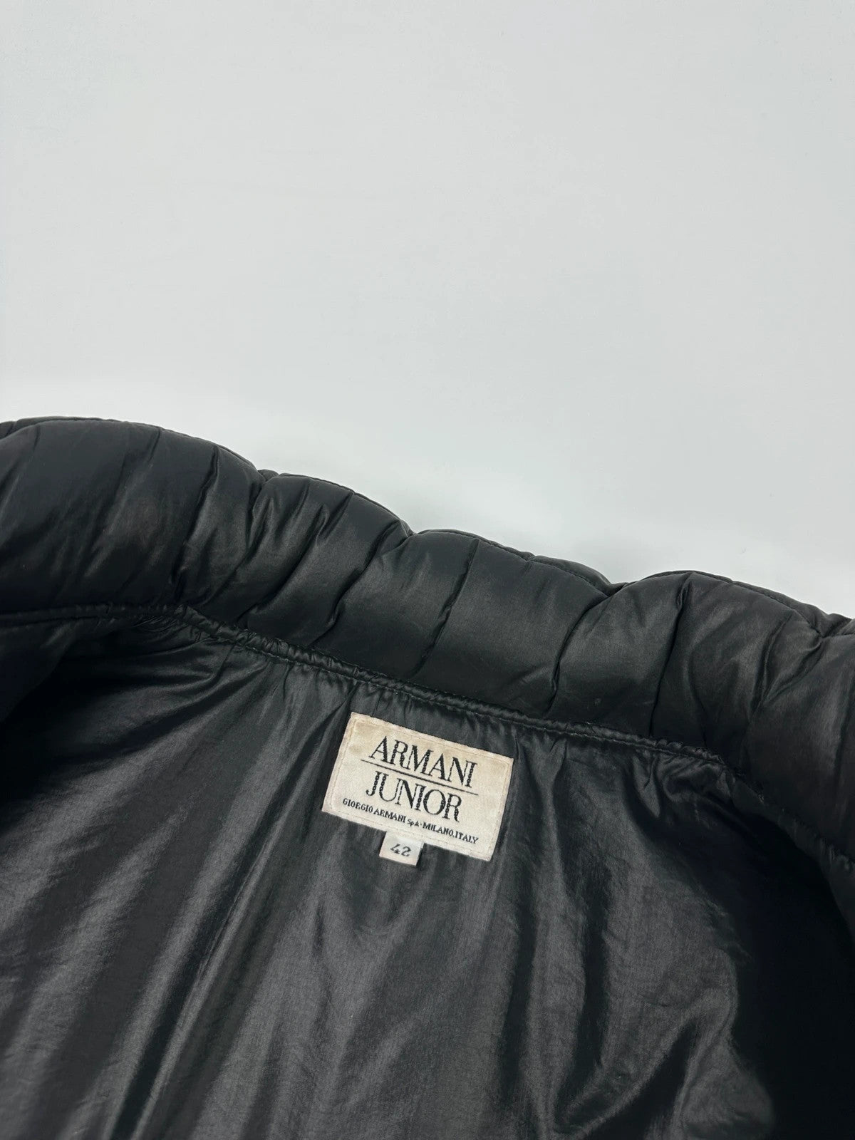 Armani black puffer bomber jacket, leather and nylon, removable sleeves, vintage 90s style.