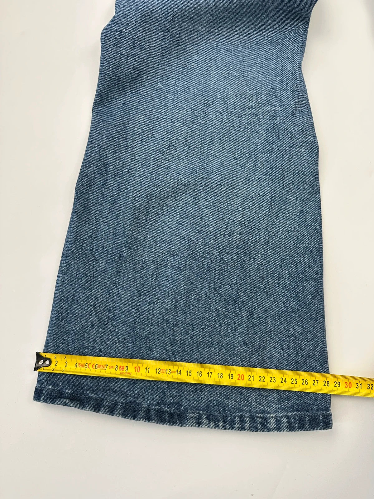 Marithé François Girbaud blue denim flared jeans with twisted design and vintage 90s style.