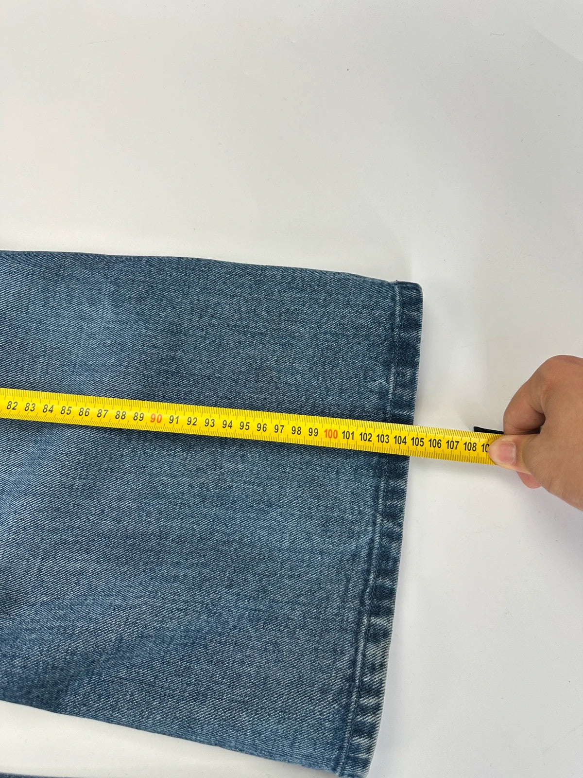 Marithé François Girbaud blue denim flared jeans with twisted design and vintage 90s style.