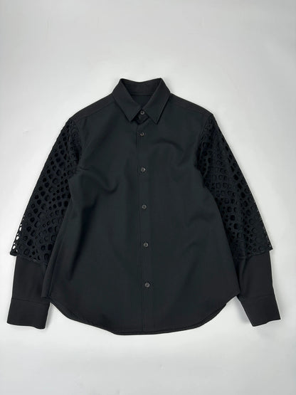 Y's by Yohji Yamamoto black shirt with mesh sleeves and subtle logo details.