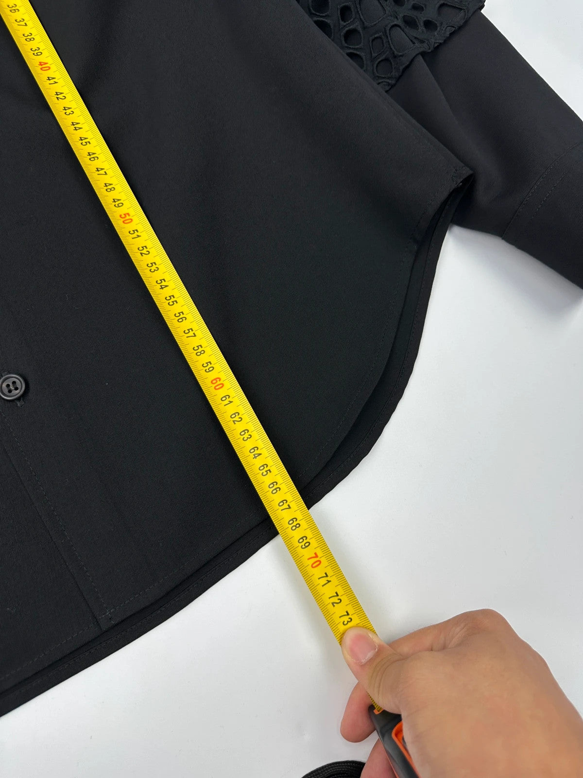 Y's by Yohji Yamamoto black shirt with mesh sleeves and subtle logo details.