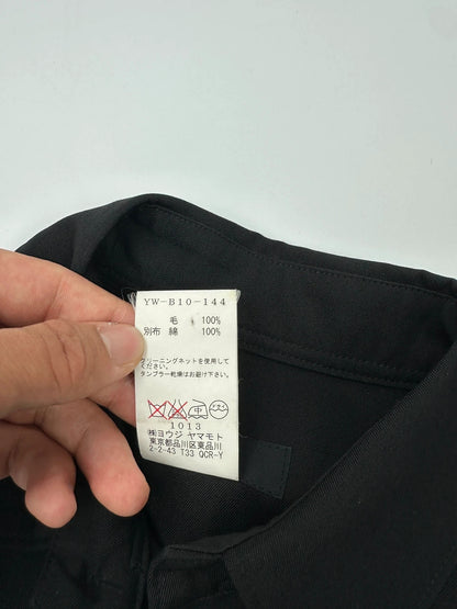Y's by Yohji Yamamoto black shirt with mesh sleeves and subtle logo details.