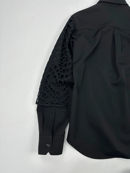 Y's by Yohji Yamamoto black shirt with mesh sleeves and subtle logo details.