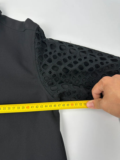 Y's by Yohji Yamamoto black shirt with mesh sleeves and subtle logo details.