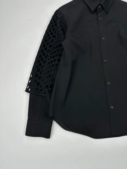 Y's by Yohji Yamamoto black shirt with mesh sleeves and subtle logo details.