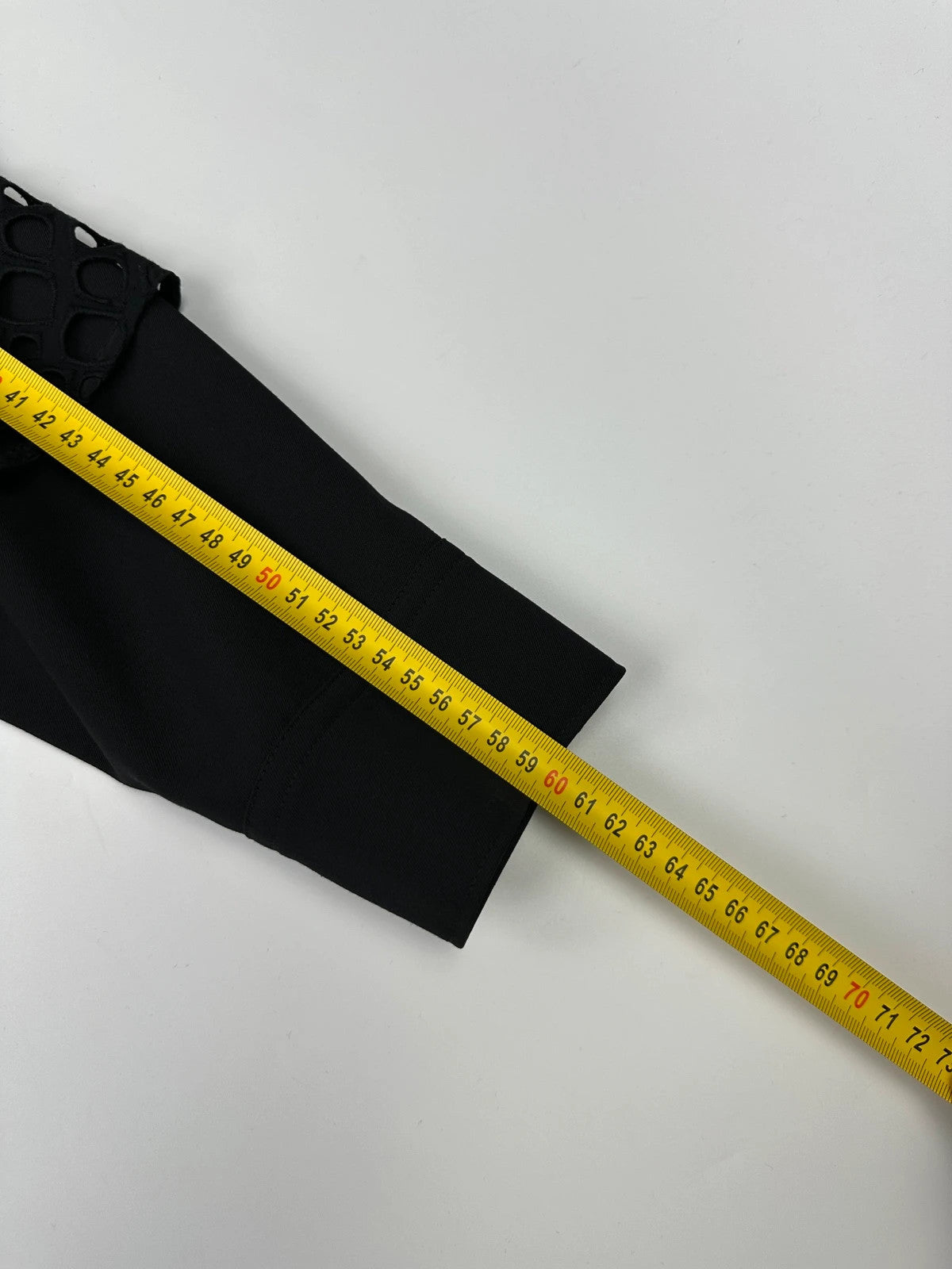 Y's by Yohji Yamamoto black shirt with mesh sleeves and subtle logo details.