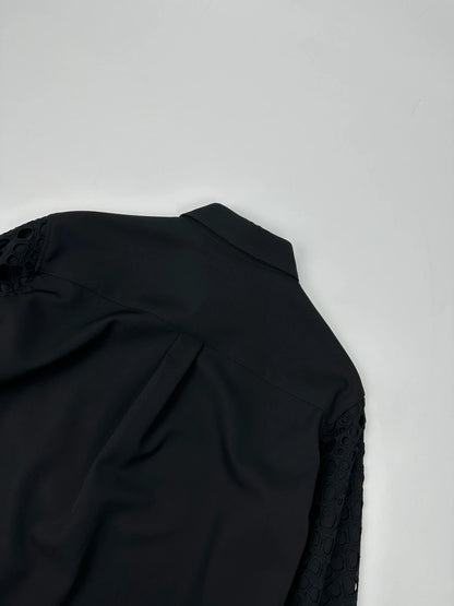 Y's by Yohji Yamamoto black shirt with mesh sleeves and subtle logo details.