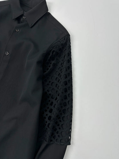 Y's by Yohji Yamamoto black shirt with mesh sleeves and subtle logo details.