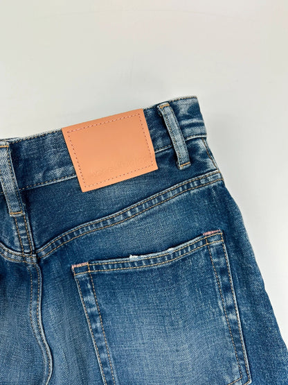 Acne Studios blue wide leg denim pants with subtle logo detailing and vintage style.